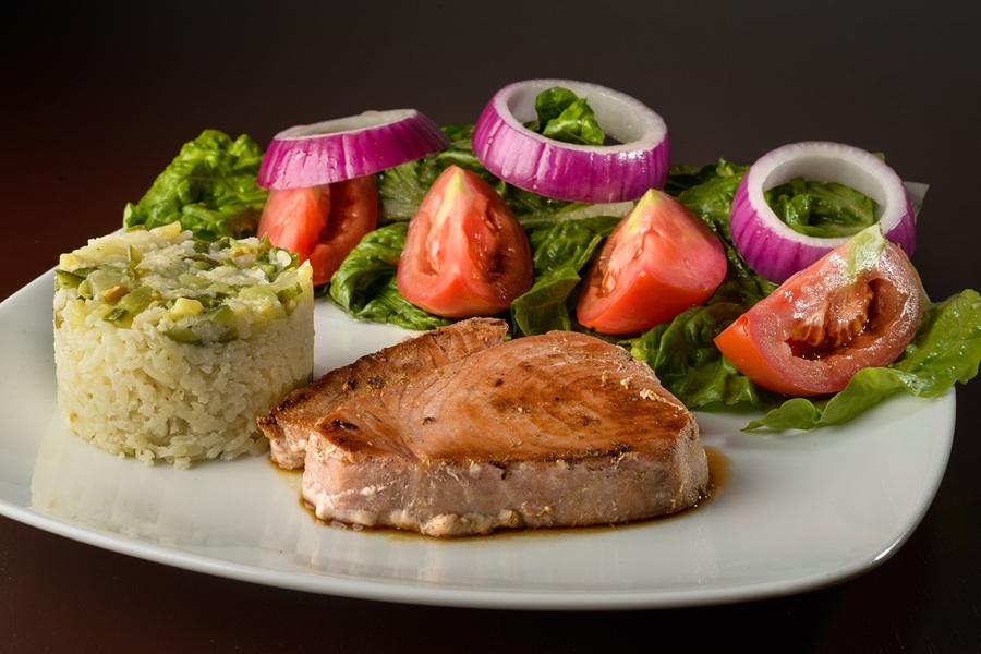 Easy Instant Pot Pork Chops Recipes a Pork Chop Dinner on a Plate with Rice and a Salad
