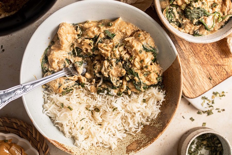 Slow Cooker Chicken and Spinach Rice Bowl Recipe Overhead View of a Bowl of Spinach Chicken with Jasmine Rice and a Fork