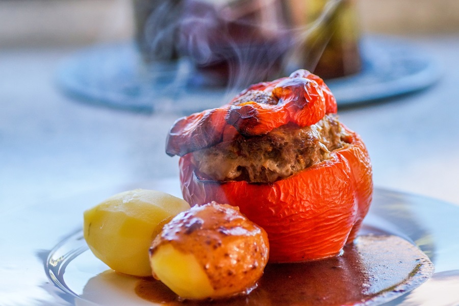 Best Stuffed Bell Peppers with Ground Beef Recipes a Red Stuffed Bell Pepper on a Plate with Two Small Potatoes Next to it
